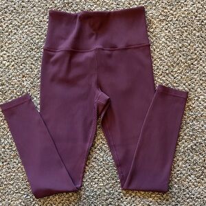 Athleta brand Women’s ribbed tight. Size small. Color is spiced cabaret.